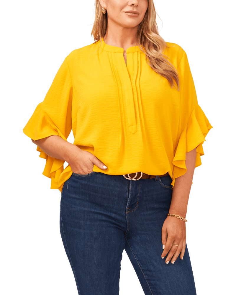 Front of a model wearing a size 1X Aubrey Ruffle Sleeve Blouse in GOLDEN by Vince Camuto. | dia_product_style_image_id:261057